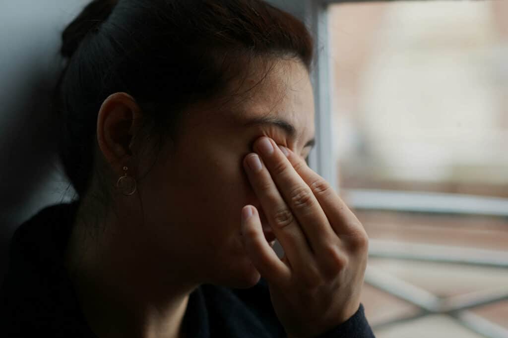 Woman suffering from dry eye disease